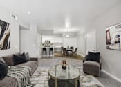 Thumbnail 2 of 18 - the living room and dining room of an apartment with couches and a table
