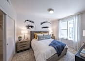 Thumbnail 6 of 28 - a bedroom with a large bed and a window