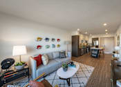 Thumbnail 8 of 28 - a living room with a couch and a table
