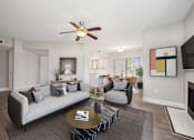 Thumbnail 6 of 33 - a living room with a couch and a table