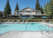 Thumbnail 15 of 32 - Swimming Pool And Relaxing Area at Atwood Apartments, California