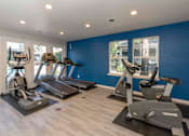 Thumbnail 12 of 32 - Cardio Machines In Gym at Atwood Apartments, Citrus Heights, CA