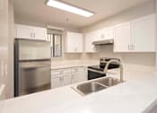 Thumbnail 2 of 22 - Sink With Faucet In Kitchen at Del Norte Place Apartment Homes, El Cerrito, California