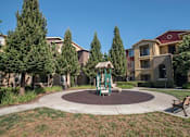 Thumbnail 15 of 19 - Tot Lot And Playing Field at Sterling Village Apartment Homes, California