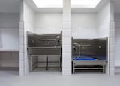 Thumbnail 23 of 24 - a room with a sink and a bed in it