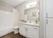Thumbnail 15 of 33 - a bathroom with a toilet sink and a mirror