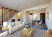 Thumbnail 3 of 15 - a living room with a couch and a table