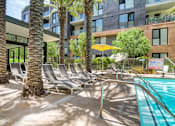 Thumbnail 19 of 26 - Poolside Sundeck With Relaxing Chairs at Block C, San Marcos, CA