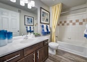 Thumbnail 6 of 31 - a bathroom with a tub sink and toilet and a shower