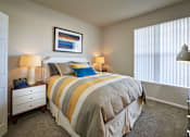 Thumbnail 8 of 31 - a bedroom with a bed and two windows