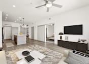 Thumbnail 5 of 24 - an open living room with a kitchen and a ceiling fan