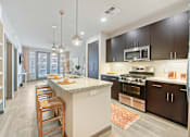 Thumbnail 11 of 29 - Kitchen island at Centra Midtown Apartments