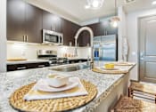 Thumbnail 12 of 29 - Kitchen counter at Centra Midtown Apartments