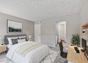 Thumbnail 9 of 21 - an open bedroom with a bed and a desk with a computer