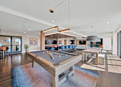 Thumbnail 11 of 30 - a game room with a pool table and a bar