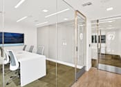 Thumbnail 29 of 37 - a conference room with a white table and chairs