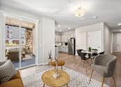 Thumbnail 4 of 19 - a living room with a table and chairs and a kitchen
