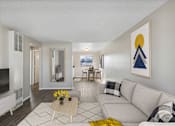 Thumbnail 2 of 10 - a living room with a couch and a table and a television