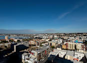 Thumbnail 25 of 26 - a view of the city from the roof of a building