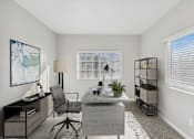Thumbnail 6 of 18 - an office with a desk and a chair and a window