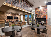 Thumbnail 16 of 24 - a restaurant with tables and chairs and a bar and a television