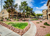Thumbnail 13 of 20 - A residential area with houses and a curved pathway.