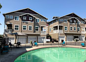 Thumbnail 8 of 16 - Chairs and Table on Sundeck near Pool at Westview Heights Apartments, 18301 NW Chemeketa Lane, OR