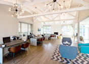 Thumbnail 22 of 27 - a view of the lobby of a building with couches and chairs and a large