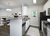 Thumbnail 1 of 31 - an open kitchen with a large island and a dining table