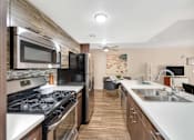 Thumbnail 2 of 23 - Furnished Kitchen at The Lexington Apartments
