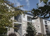 Thumbnail 17 of 18 - Building exterior with foliage at Marina Village Apartments, Sparks 89434