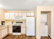 Thumbnail 15 of 29 - the preserve at ballantyne commons apartment kitchen with white appliances