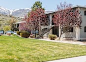 Thumbnail 4 of 29 - an apartment building with mountains in the background