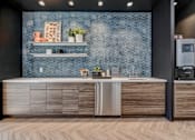 Thumbnail 15 of 23 - resident social lounge kitchen at Novo Apartments