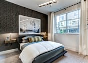 Thumbnail 4 of 23 - a bedroom with a bed and a window