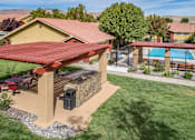 Thumbnail 27 of 30 - Shaded Patio With BBQ at Vizcaya Hilltop Apartments, Nevada