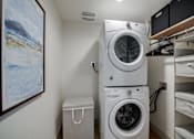 Thumbnail 7 of 26 - a washer and dryer in a laundry room with a closet