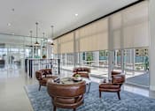 Thumbnail 17 of 24 - Clubhouse seating views at Parq Crossing Apartments