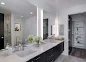 Thumbnail 7 of 26 - a bathroom with two sinks and a large mirror
