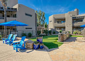 Thumbnail 14 of 21 - Garden Courtyard With Grills And Fireplace at Scottsdale Horizon Apartments, Scottsdale, 85260