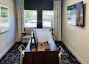Thumbnail 15 of 18 - an office with a desk and two chairs