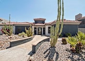 Thumbnail 33 of 33 - a house with a pathway and cactus in front of it