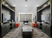 Thumbnail 19 of 30 - A modern living room with a long table and two TVs.