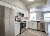 Thumbnail 2 of 28 - Spacious Kitchen at The Retreat Apartments in Phoenix, Arizona