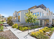 Thumbnail 17 of 20 - A modern house with a garden in front.