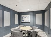 Thumbnail 19 of 26 - a meeting room with chairs and tables and a painting on the wall