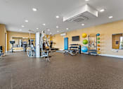 Thumbnail 41 of 53 - A spacious gym with a variety of exercise equipment.