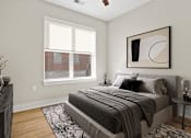 Thumbnail 6 of 53 - A bedroom with a large bed and a window.