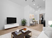 Thumbnail 8 of 8 - A modern living room with a flat screen TV on a white stand.