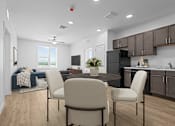 Thumbnail 12 of 16 - Modern kitchen with a dining table at 36N Apartments, Tulsa